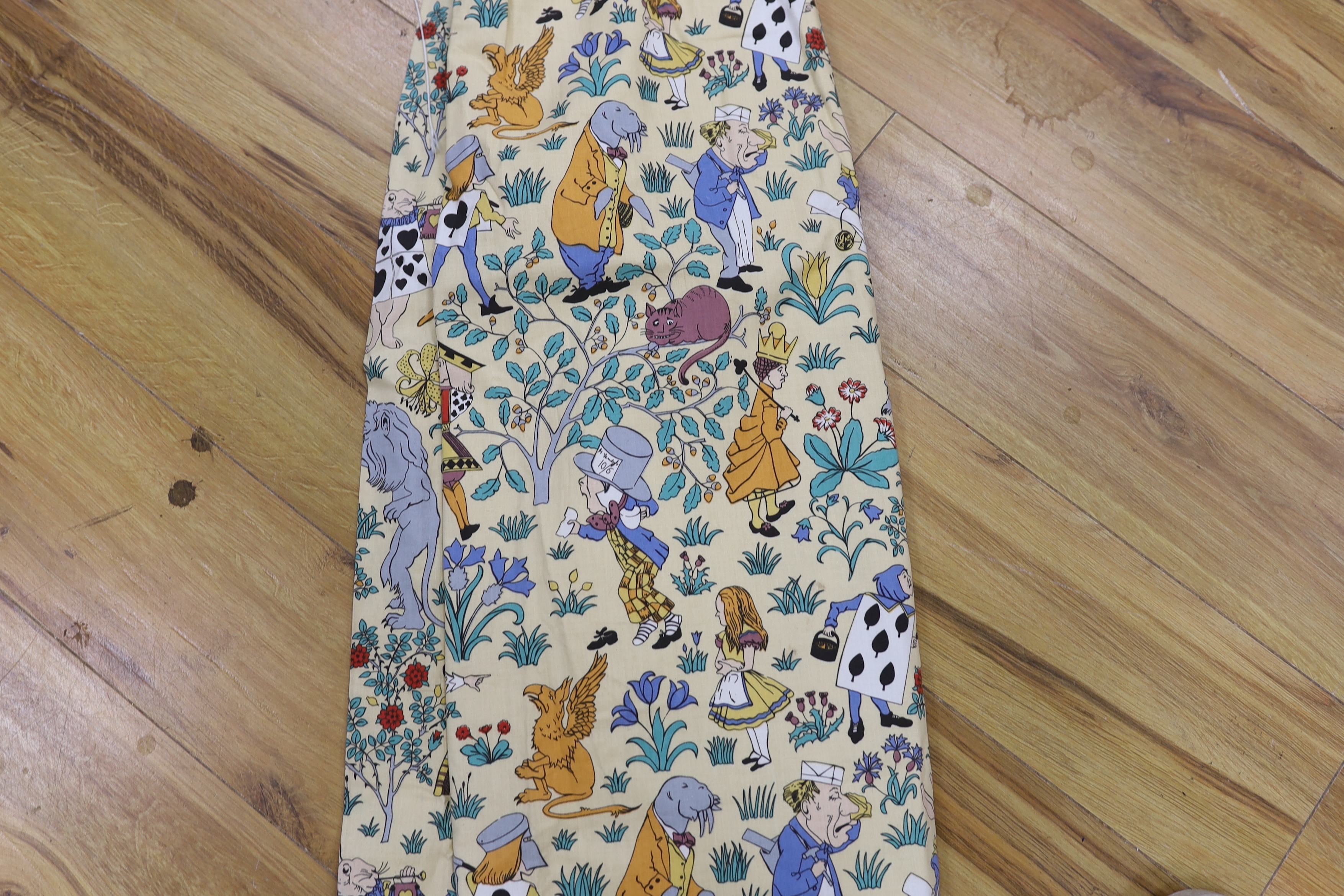 A late 1980’s vintage curtain of Alice in Wonderland, design originally by C. F. A. Voysey; selvage printed; The Habitat V&A collection, 130cm wide at the bottom, 130cm long